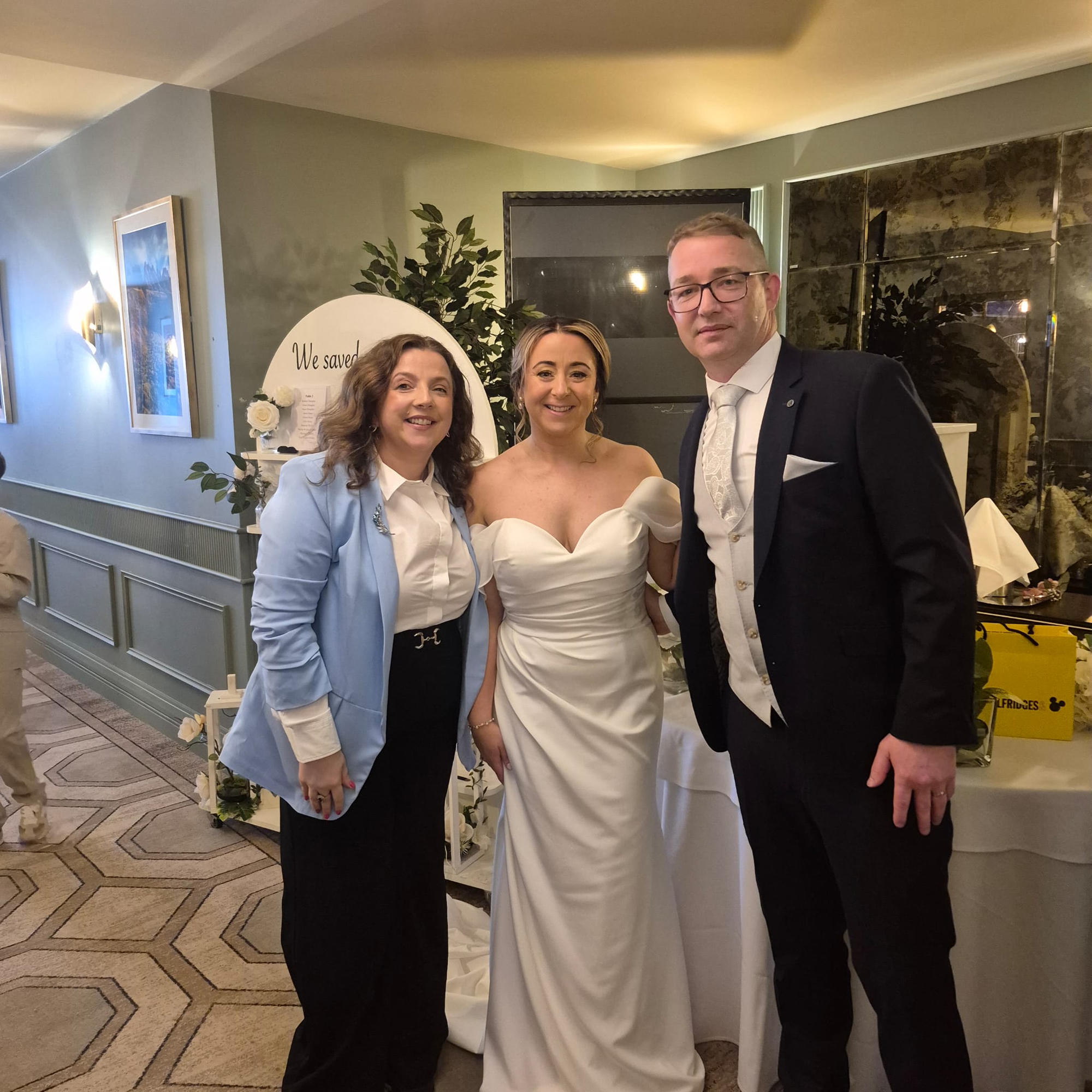 Celebrant Pam celebrating with a newly married couple